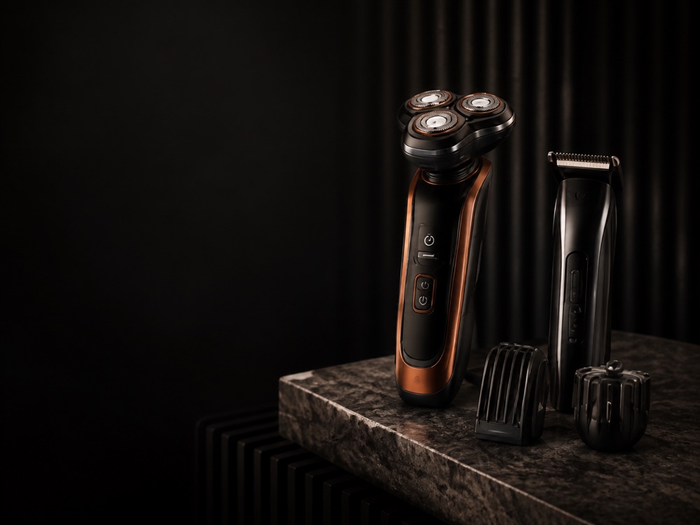 Electric shaver and trimmer on a dark counter