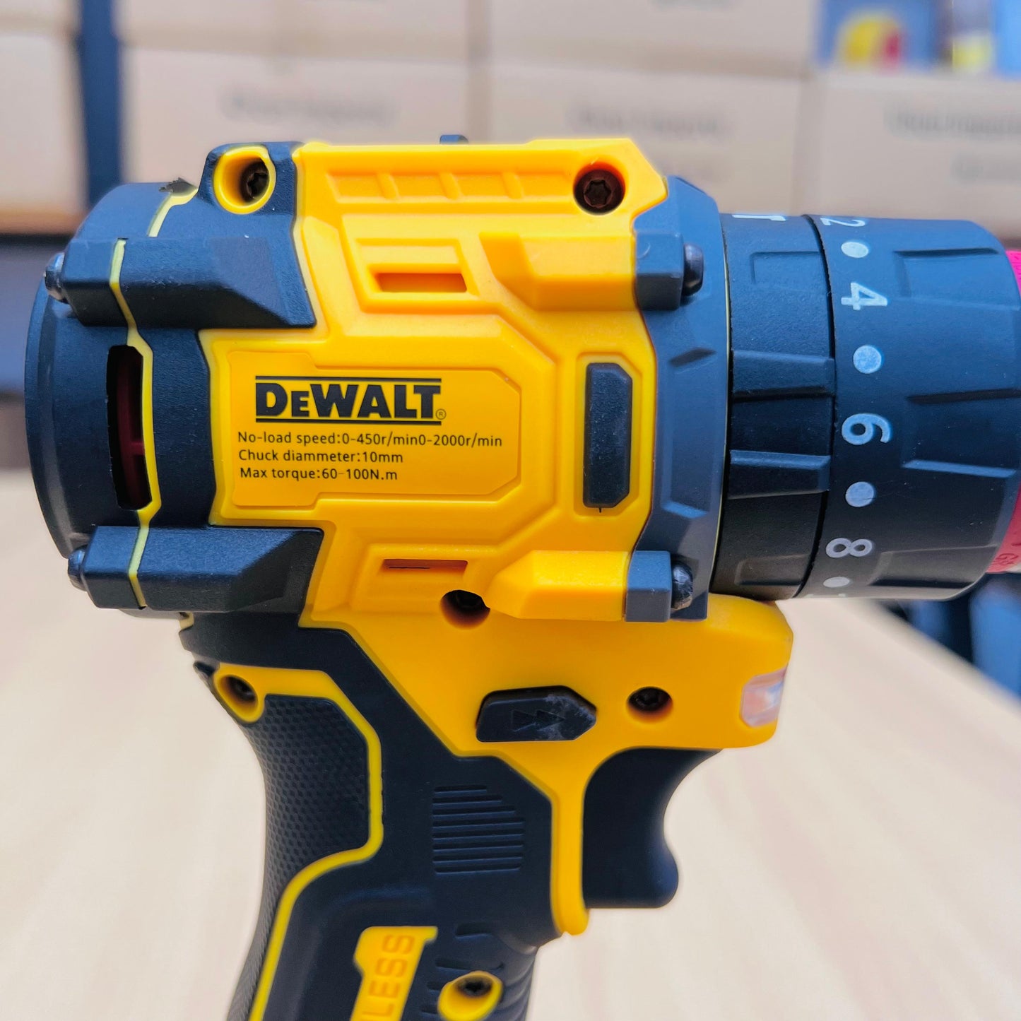 DeWalt cordless drill with yellow and blue design on a neutral background